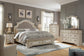 Realyn King Upholstered Bed with Mirrored Dresser